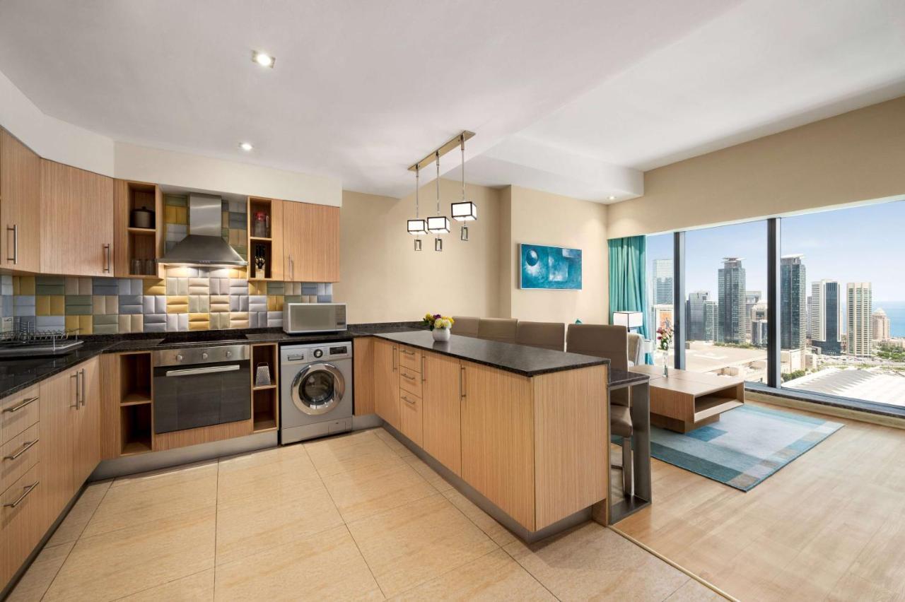 Wyndham Doha West Bay Hotel Exterior photo A typical apartment interior