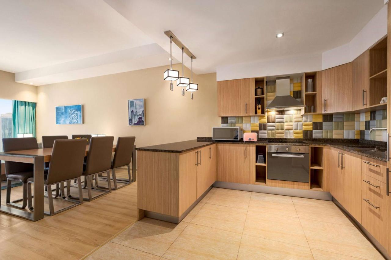 Wyndham Doha West Bay Hotel Exterior photo A typical kitchen in a serviced apartment